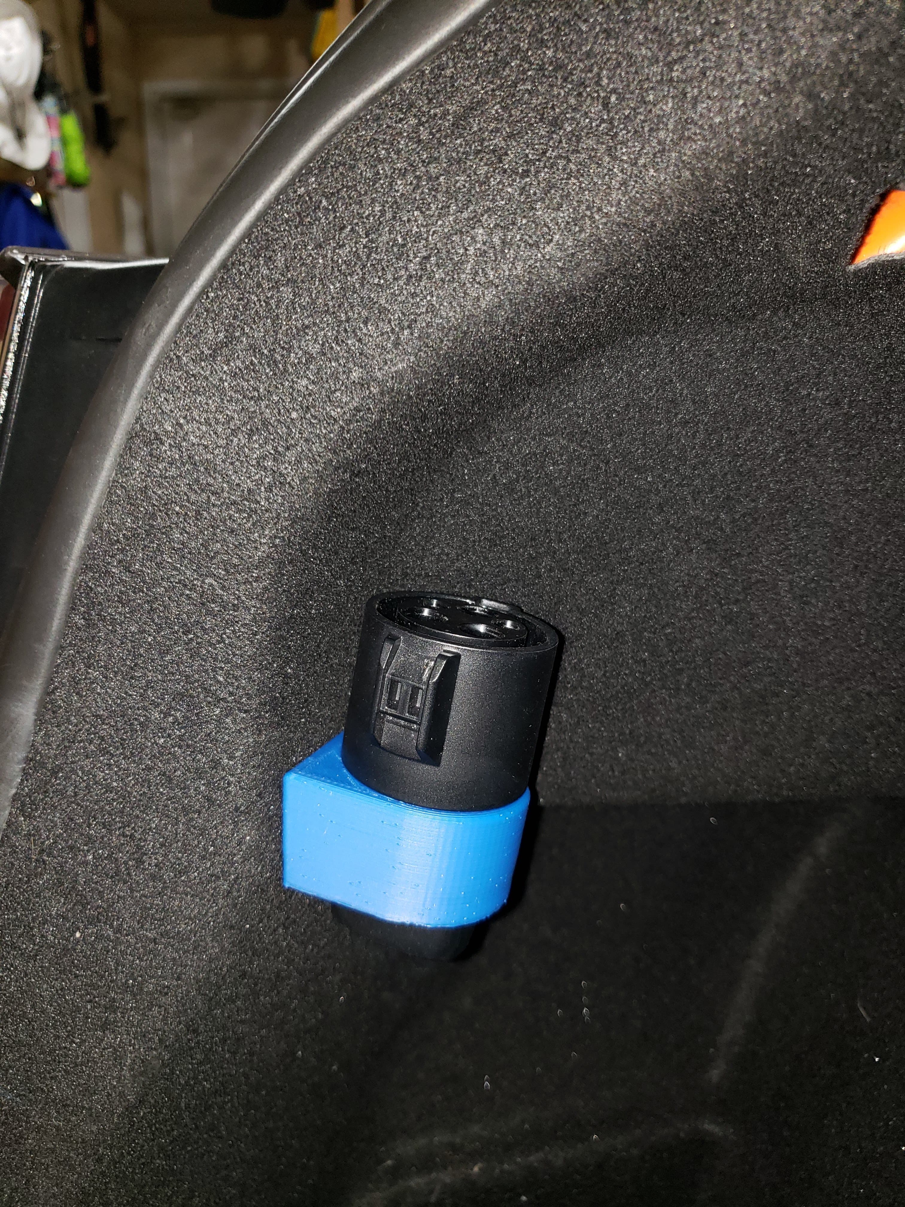 Photo of Tesla charger adapter holder for Model 3 trunk