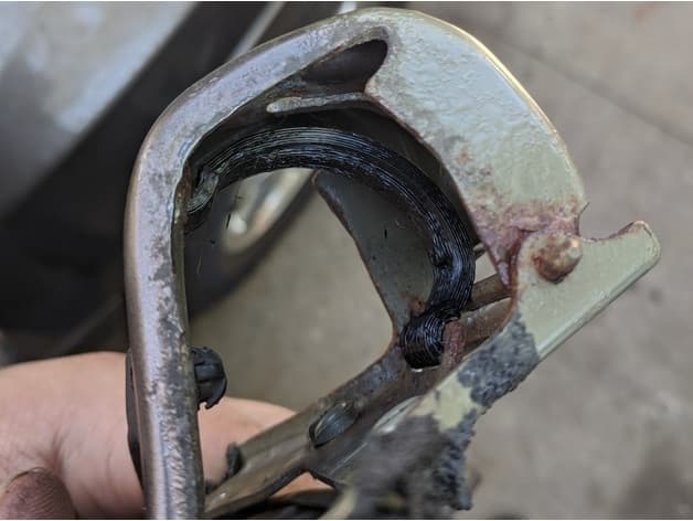 Photo of GMC Envoy & Chevy Trailblazer Fuel Door Spring
