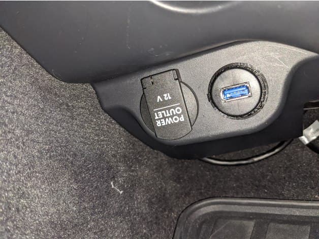 Photo of Adapter for placing flush mount round USB port under dash of second generation Porsche Cayenne (958)