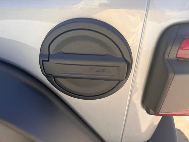 Jeep Wrangler hidden ice scraper fuel door - image