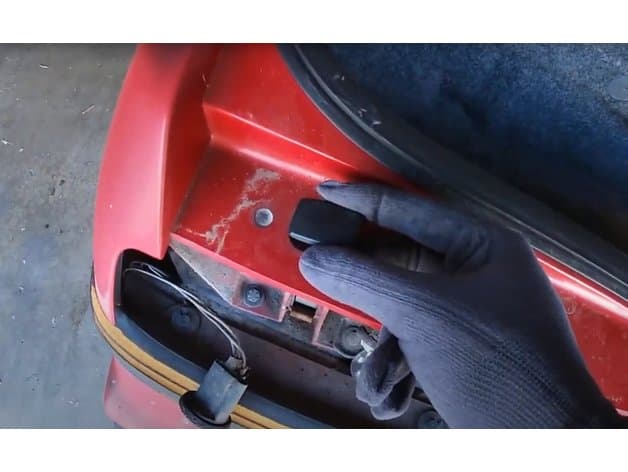 Photo of Pontiac Fiero tail light screw cap cover