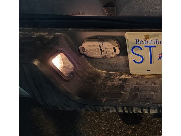 Photo of Toyota Tacoma glare blocker for better backup camera view (license plate lights)