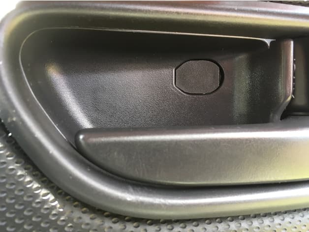 Photo of Subaru Forester SG (2002 - 8) door release lever screw cover.