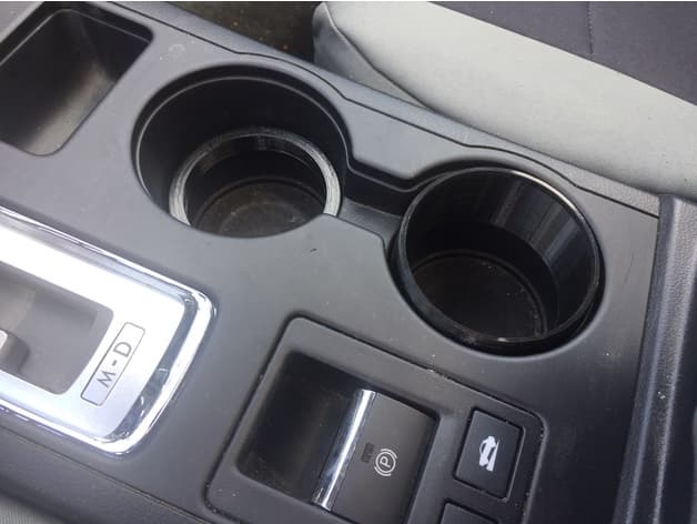 2016 Subaru Outback cup holder spacers for cans and bottles - image