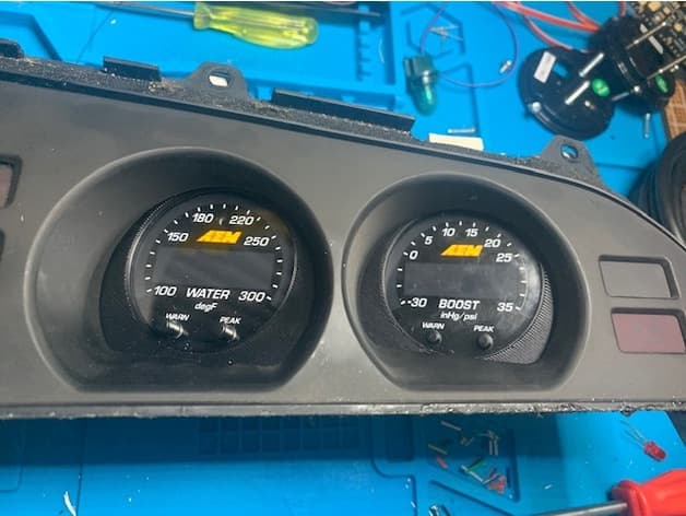 Photo of Supra Mk3 cluster's oil gauge adapter for AEM x-series gauge